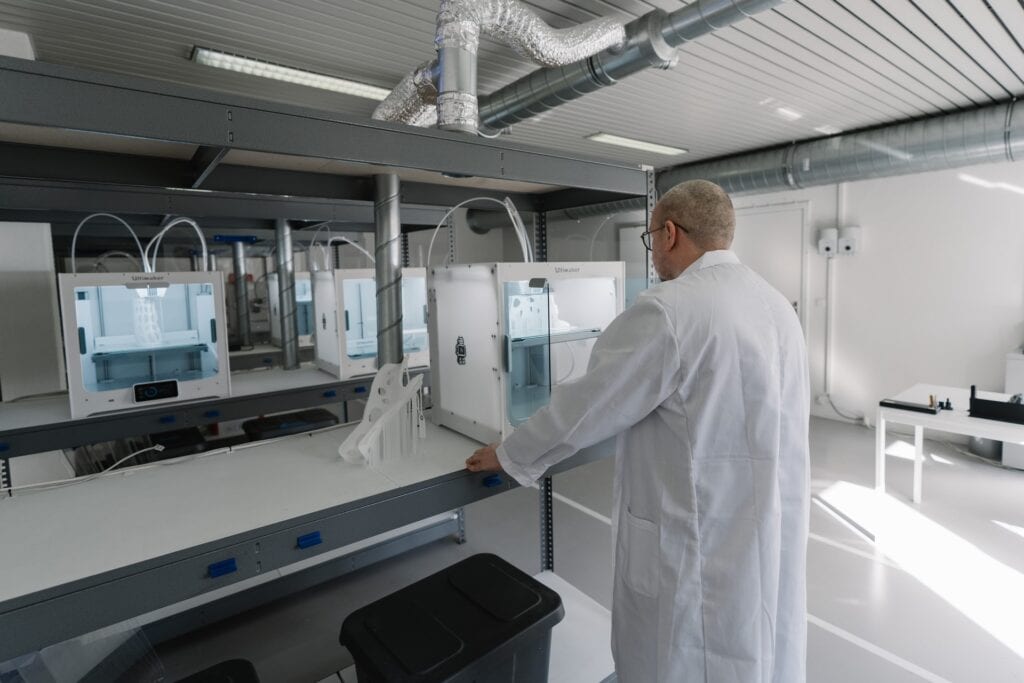 Man in white coat in laboratory