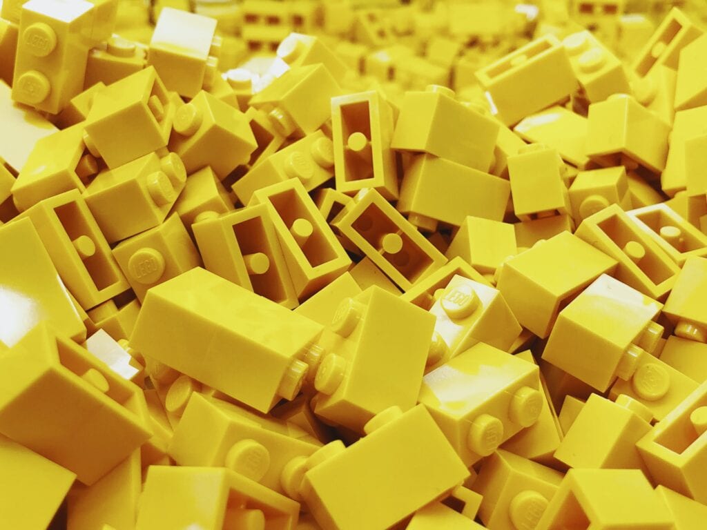 Small yellow plastic toy pieces