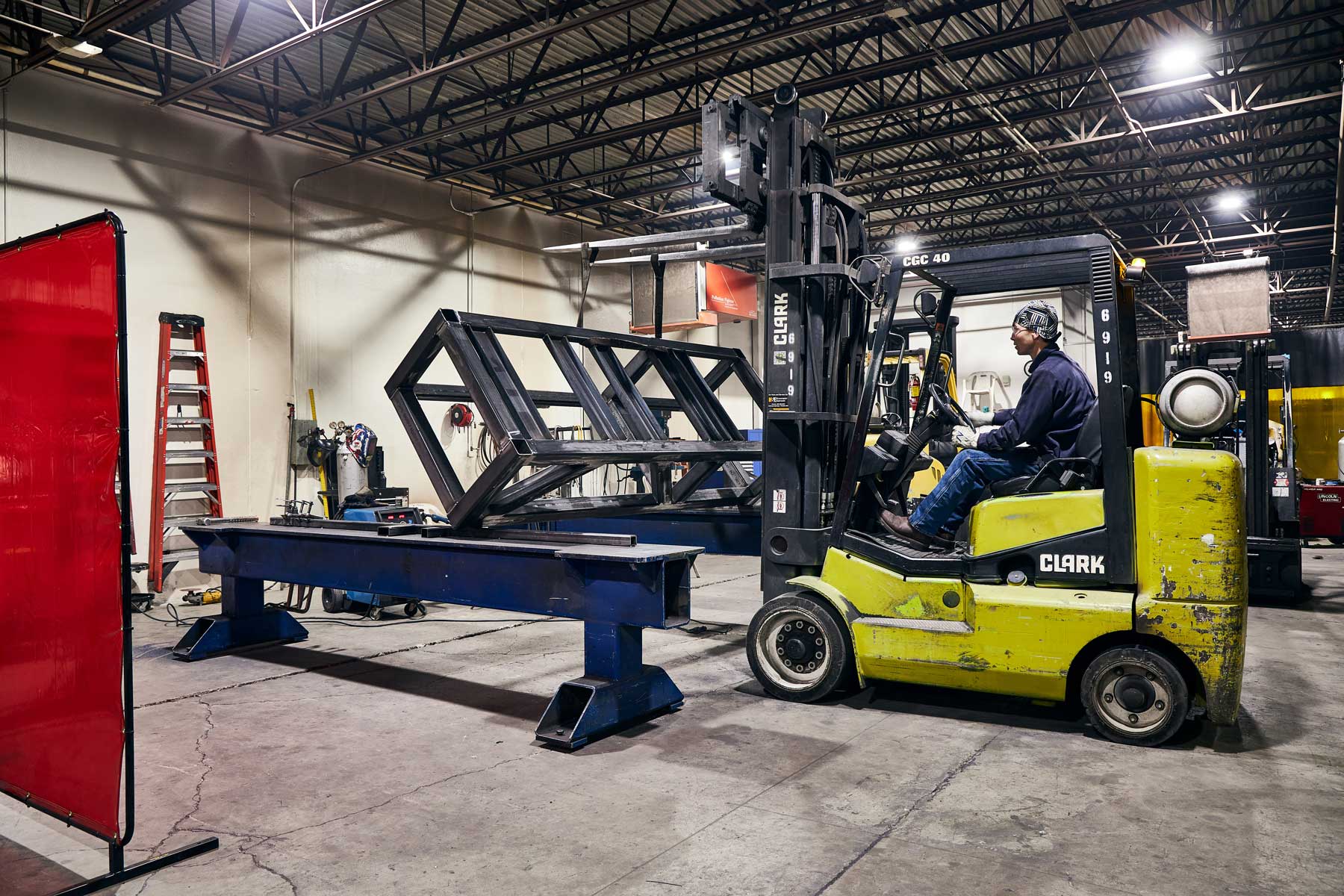 Man operating forklift on DMS floor