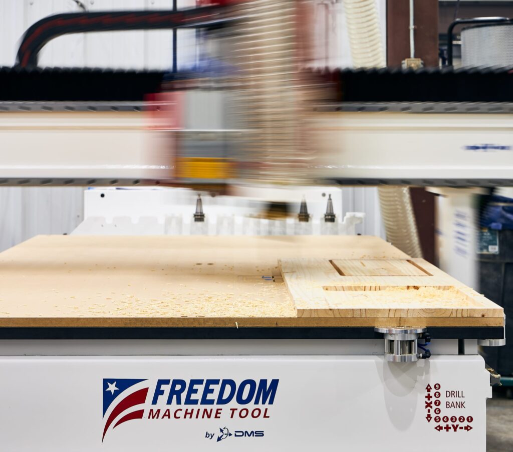 DMS Freedom 8 carving a wooden sign